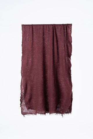 Teal wine red felted cashmere scarf folded in half in front of grey background. 