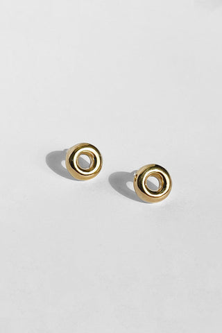 Electroplated brass Donut stud earrings by Kara Yoo. 