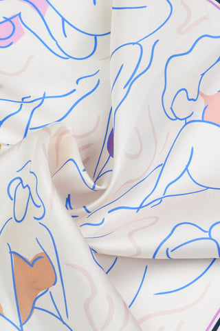 Close-up of off-white silk twill scarf with multi-colour print of voluminous women. 