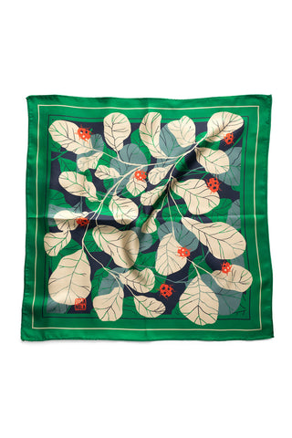 Green silk twill neckerchief with cream leaves and red ladybug print. 