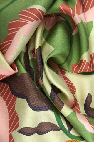 Close-up of green, rose and brown printed silk twill scarf. 