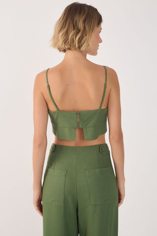 Back view of woman wearing green tank top with spaghetti straps and matching green pants. 