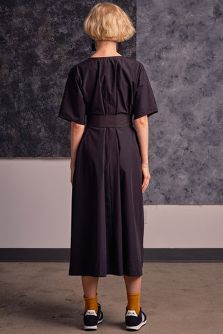 Back view of model wearing black coloured OEKO-TEK belted Adira Shift Dress by Jennifer Glasgow. 