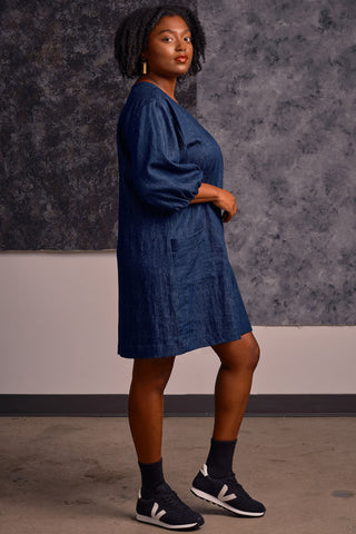 Side view of model wearing v-neck organic cotton / hemp blend denim Alexandra tunic by Jennifer Glasgow. 