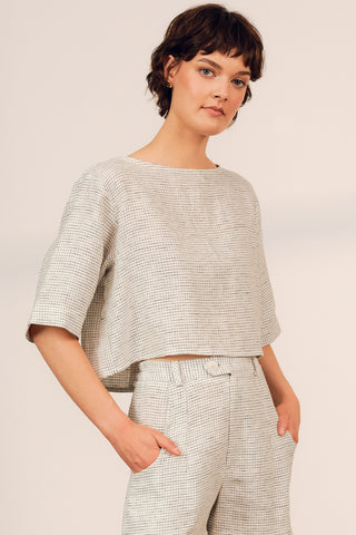Woman wearing boxy linen blend grid print Cardera Top by Jennifer Glasgow. 