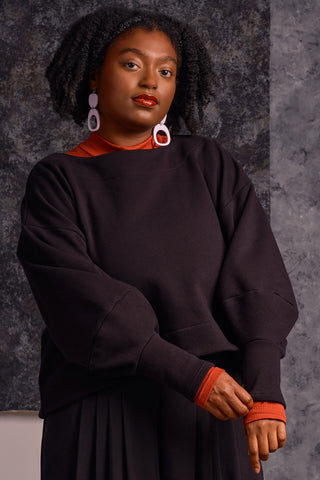 Model wearing black OEKO-TEK tencel organic cotton blend Clyde Sweater by Jennifer Glasgow. 