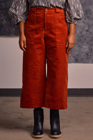 Model wearing rust corduroy Elliot pants by Jennifer Glasgow. 