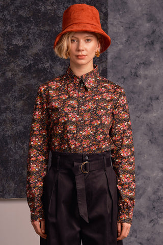 Model wearing red floral print Fianna button up shirt by Jennifer Glasgow. 
