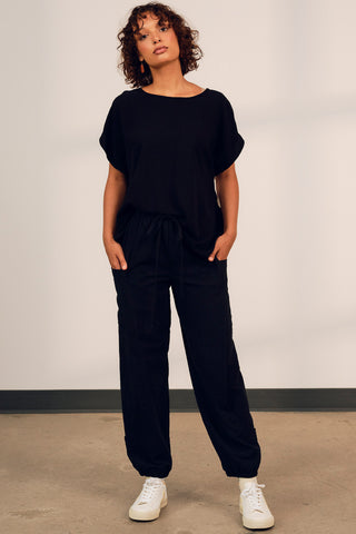 Model wearing black cotton track inspired Finnely Pants by Jennifer Glasgow. 