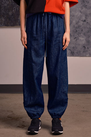 Model wearing denim Finely Pants by Jennifer Glasgow. 