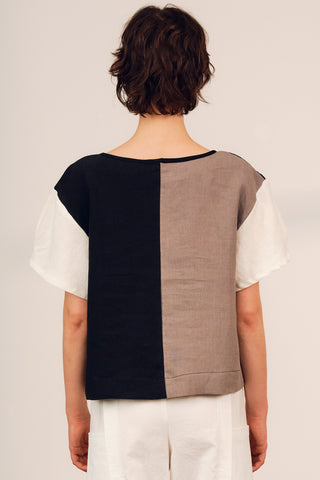 Back view of model wearing black and clay colour blocked Gaze top by Jennifer Glasgow. 