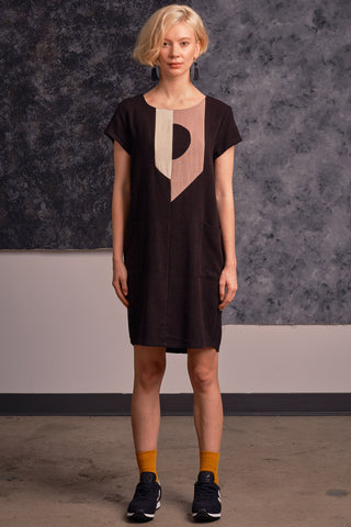 Model wearing black and fawn colour blocked short sleeved Hera tunic by Jennifer Glasgow. 