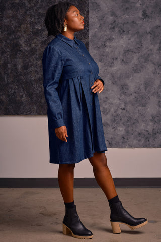 Side view of model wearing organic cotton denim shirt dress by Jennifer Glasgow. 