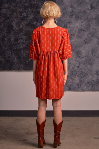 Back view of model wearing red ikat Loktak dress by Jennifer Glasgow.