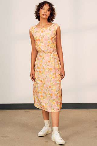 Model wearing floral print Marama midi dress by Jennifer Glasgow. 