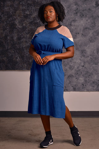 Model wearing midi length royal blue and tan colour blocked Meri dress by Jennifer Glasgow. 