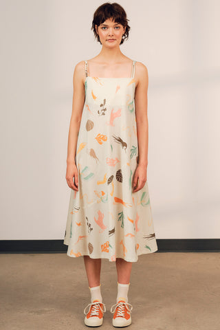 Woman wearing printed linen organic cotton blend strappy Terra Sundress by Jennifer Glasgow. 