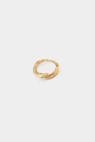 A textured gold ring with a twisted wave design, centered on a light gray background.
