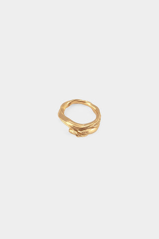 A textured gold ring with a twisted wave design, centered on a light gray background.