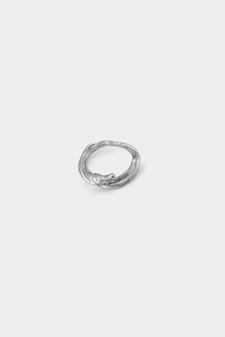 A textured sterling silver ring with a twisted wave design, centered on a light gray background.