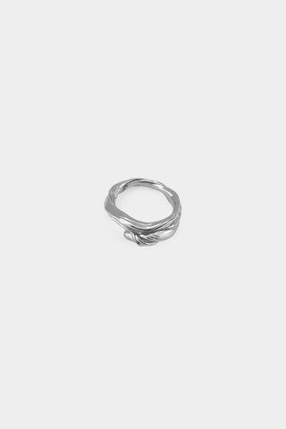 A textured silver ring with a twisted wave design, centered on a light gray background.