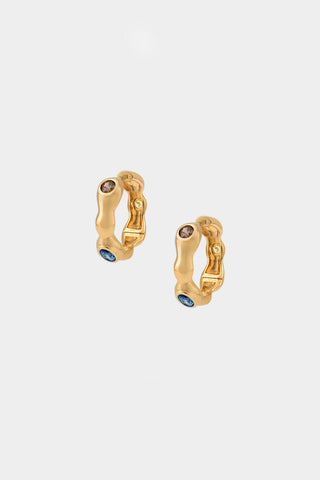 Gold hoop earrings with 3 embedded gemstones (brown, blue and yellow). 