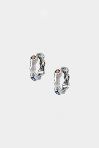 Silver hoop earrings with 3 embedded gemstones (brown, blue and yellow). 