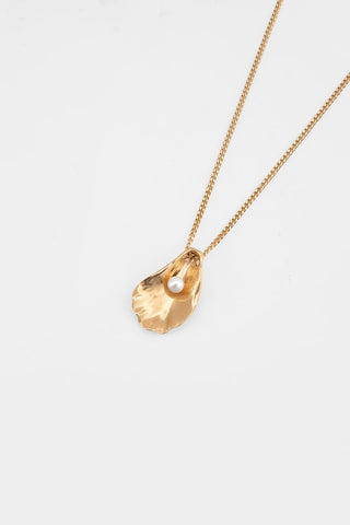 Gold plated oyster shell pendant on gold curb chain. 