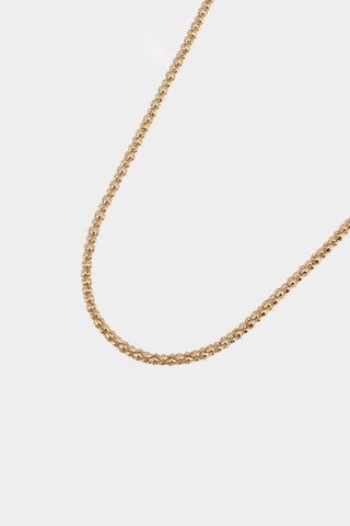 Close-up of gold plated chain necklace. 