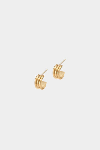 A pair of gold hoop earrings with triple-wire design, shown on a plain light gray background.