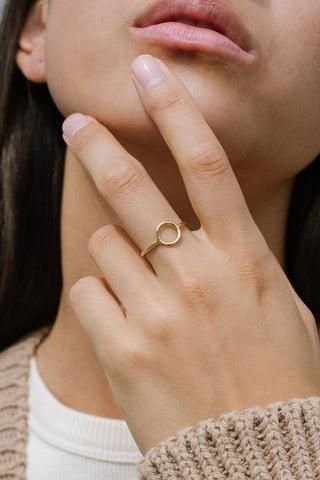 Model wearing gold vermeil Celina Circle ring by Kara Yoo