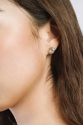 Model wearing sterling silver Donut Stud earring by Kara Yoo. 