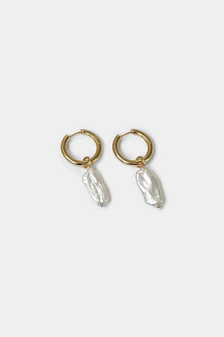 Gold vermeil Uma Hoop Earrings with Biwa Pearl Charm by Kara Yoo. 