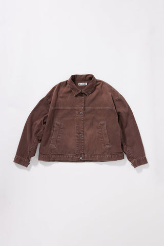 An oversized brown denim jacket with a button-up front, collar, and two front pockets, laid flat against a light gray background.