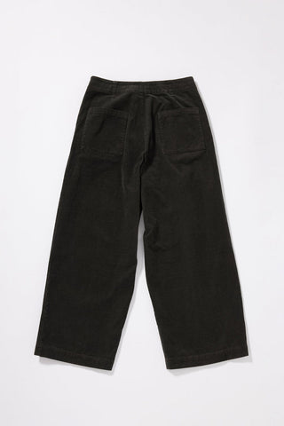 Dark brown / green pleated front wide-balloon shape trousers, shown from the back laid flat on a light gray background.