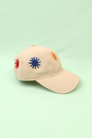 LF Markey ecru Sunny baseball cap with colourful embroidered suns. 