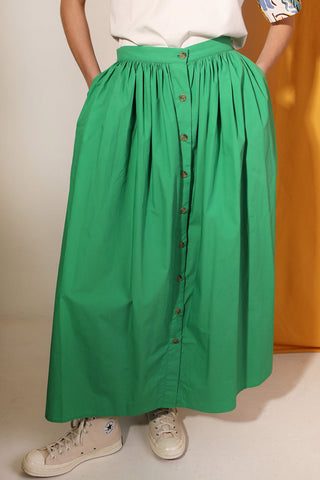 Woman wearing green cotton poplin Isaac Skirt by LF Markey. 