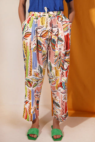 Woman wearing colourful Painted Paisley printed Mega Drawstring pants by LF Markey. 