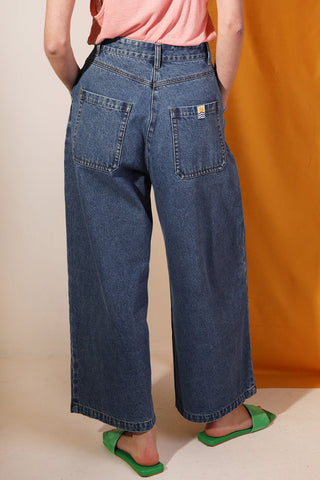 Back view of woman wearing high waist wide leg Myles jeans by LF Markey. 