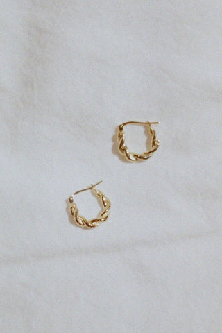 Gold braided sleeper hoop earrings. 