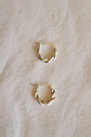 Silver braided sleeper hoop earrings. 