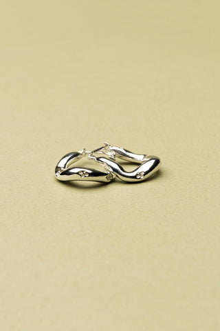Sterling silver Lupin sleeper hoop earrings by La Manufacture Fait Main.