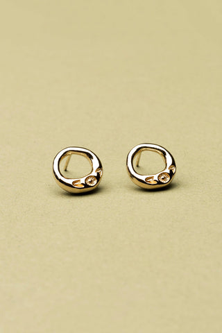 Gold vermeil Ombelle circular stud earrings by La Manufacture Fait Main. 