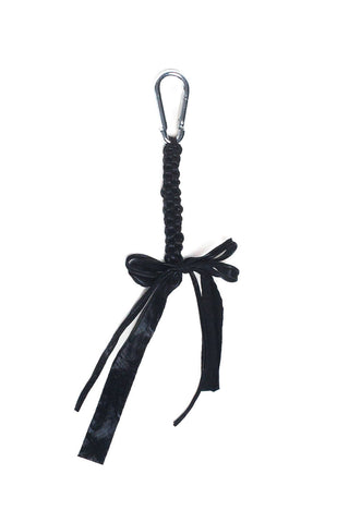 Shiny black crocheted bag charm. 