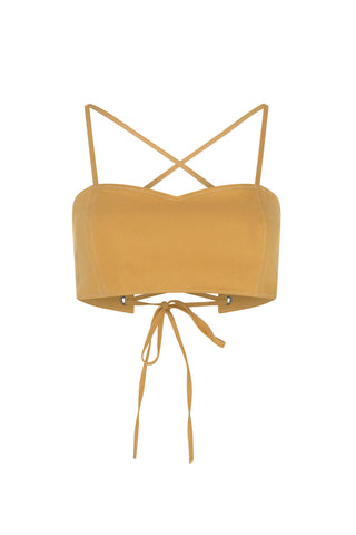 Mustard yellow crop top with thin straps on a white background