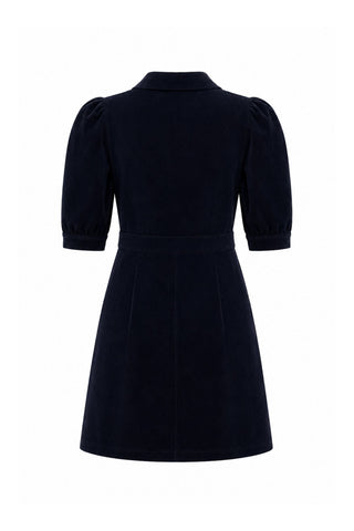 A dark navy blue corduroy dress with puff sleeves and collared neckline, shown from the back on a plain white background.