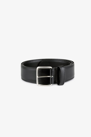 Black leather belt with rectangular silver buckle, against white background. 