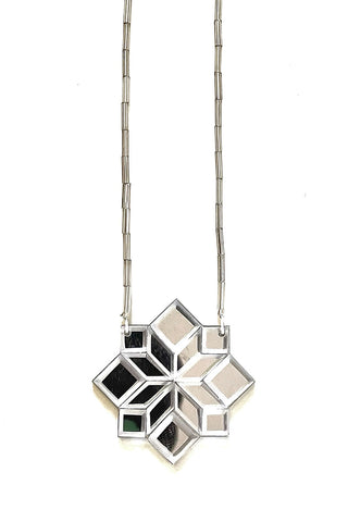 A silver mirror geometric 45 Cross Mim Té necklace. 