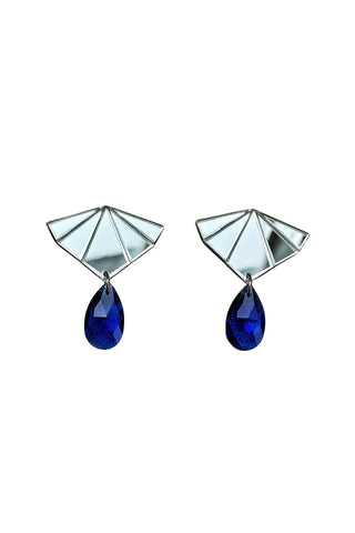 A pair of geometric drop earrings featuring faceted silver-tone metal tops and deep blue teardrop-shaped crystal pendants, shown against a plain white background.