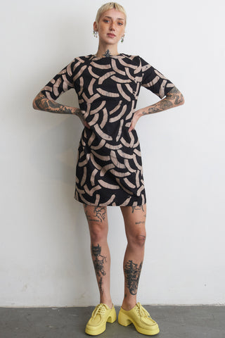 Model wearing Cantaloop print Muto dress by Osei Duro. 